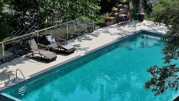 Outdoor pool, open 8:00 AM to 6:00 PM, pool umbrellas