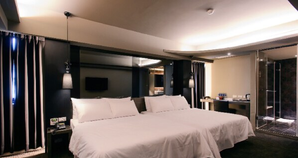 Family Room | Down comforters, desk, laptop workspace, blackout drapes