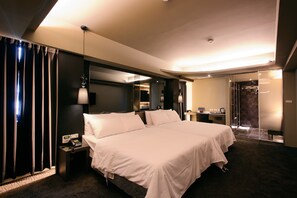 Family Room | Down comforters, desk, laptop workspace, blackout drapes