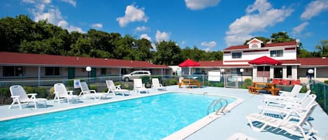 Outdoor pool, open 9 AM to 9 PM, pool umbrellas, pool loungers