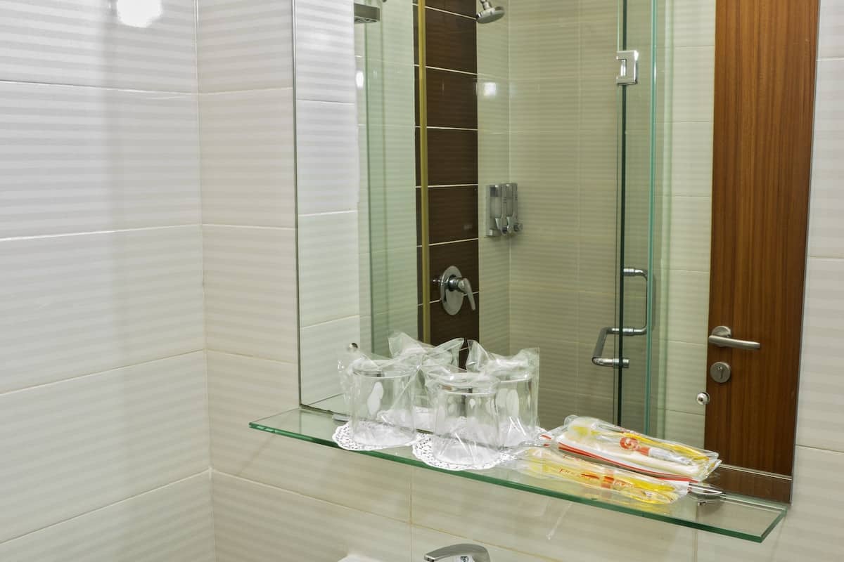 superior room | bathroom | shower, hair dryer, slippers, towels