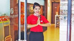 A hotel reception area with a modern design, including a glass door entrance and a visible interior space with a counter and seating area. - d'primahotel ITC Mangga Dua (Jakarta)