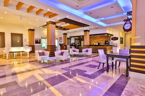 3 bars/lounges, poolside bar, beach bar