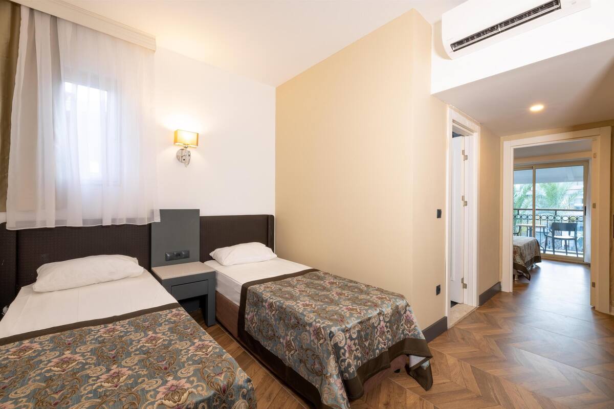 Family Room | Premium bedding, minibar (free items), in-room safe, desk