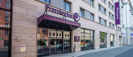 A Premier Inn hotel facade with a modern design, large windows, and a clear entrance.