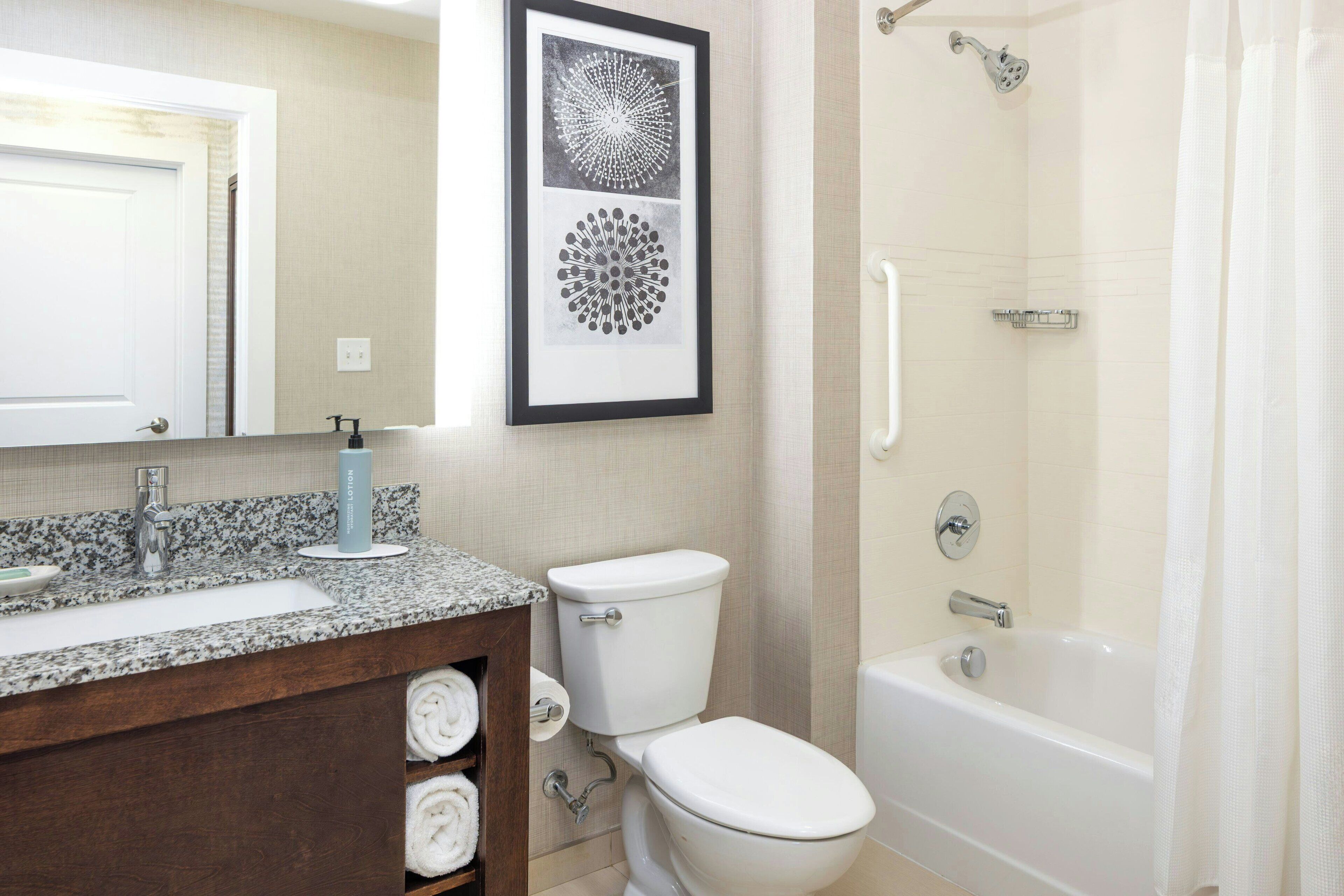 separate bathtub and shower, hair dryer, towels