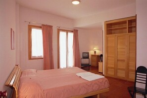 Standard Double Room | Minibar, individually furnished, desk, blackout curtains