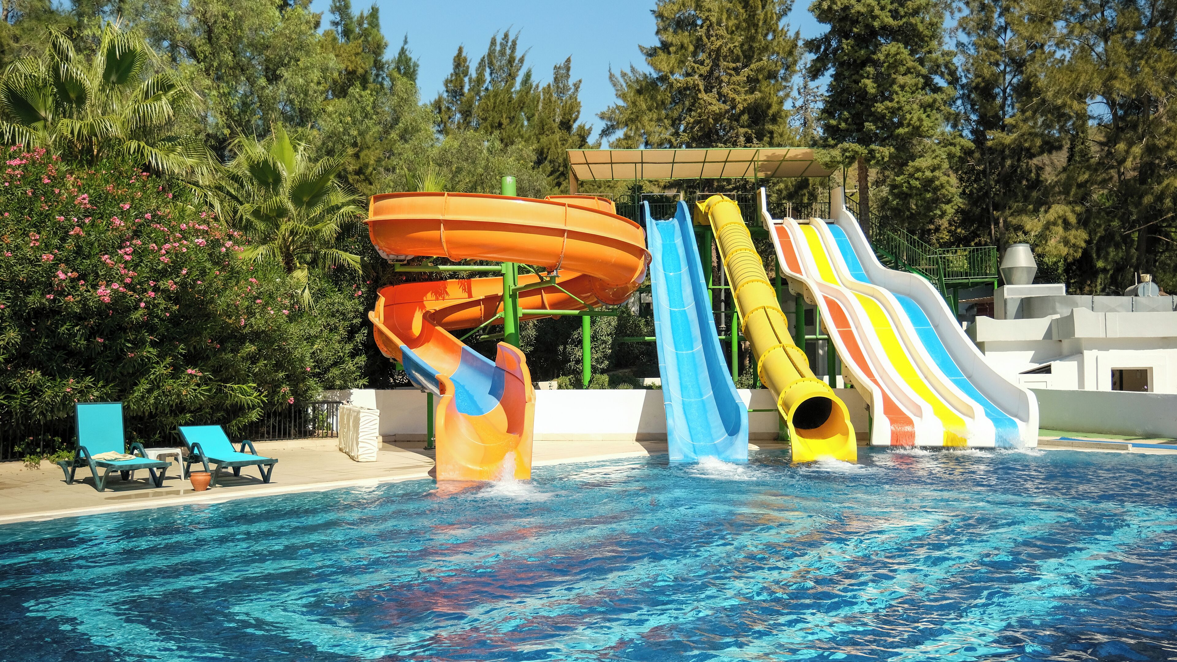 A water park with multiple slides and a pool.