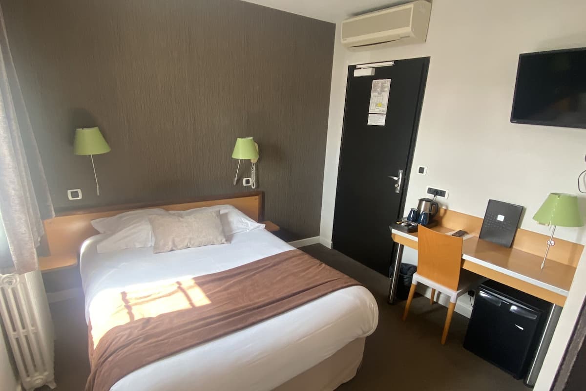 Chambre Simple Classique | Literie de qualité supérieure, minibar, bureau, rideaux occultants