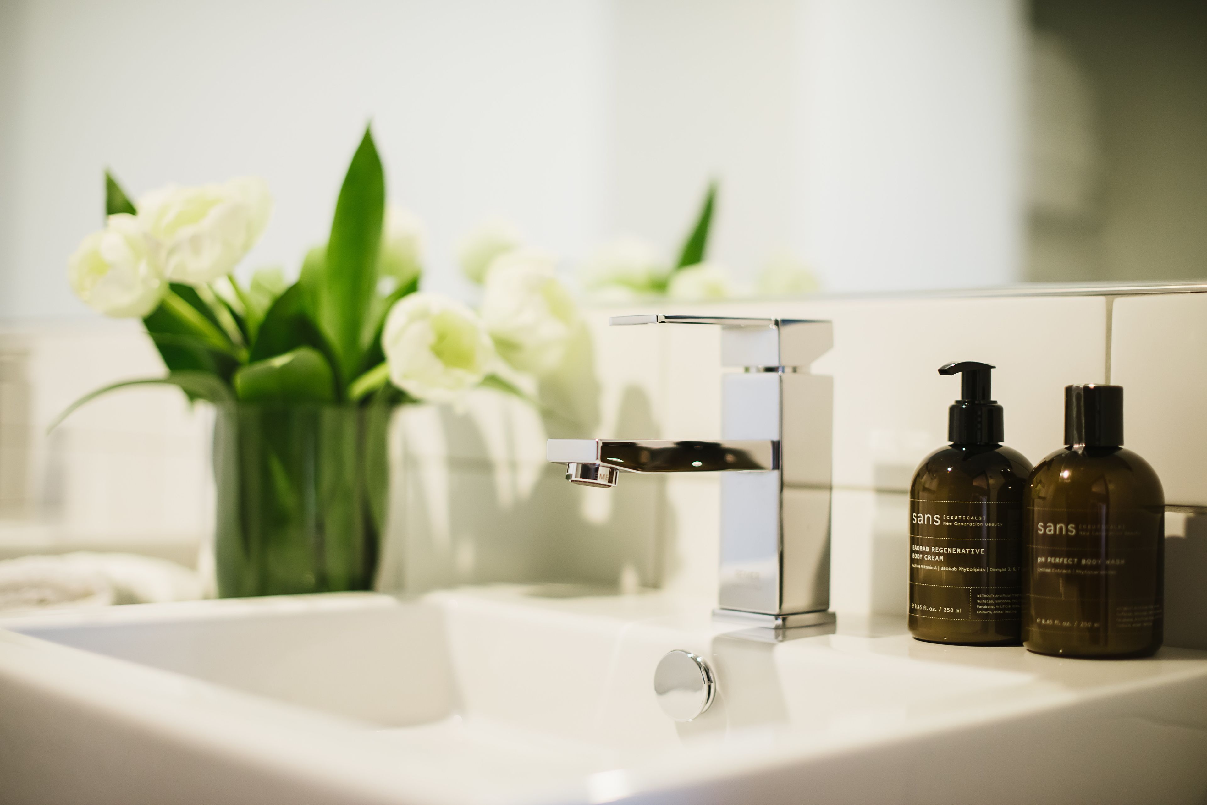 designer toiletries, hair dryer, bathrobes, slippers