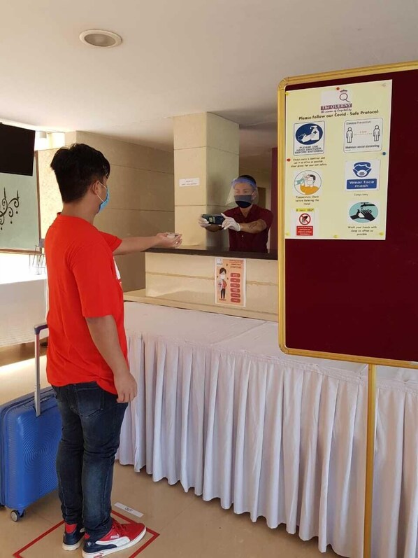 Guests are greeted by friendly staff at the reception area, where they can check in and access safety protocols.