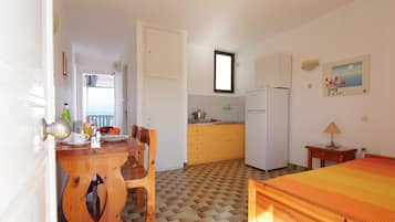 Apartment, 1 Bedroom, Sea View | Private kitchenette | Fridge, coffee/tea maker, electric kettle
