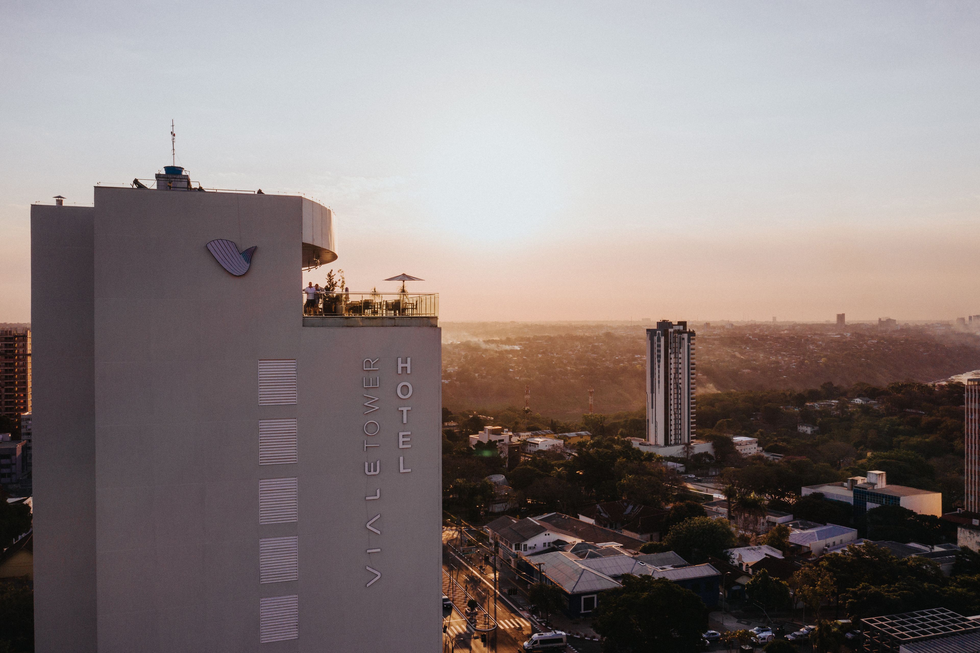 A modern building with a prominent logo and the name 'VIALETOWER' on its facade.