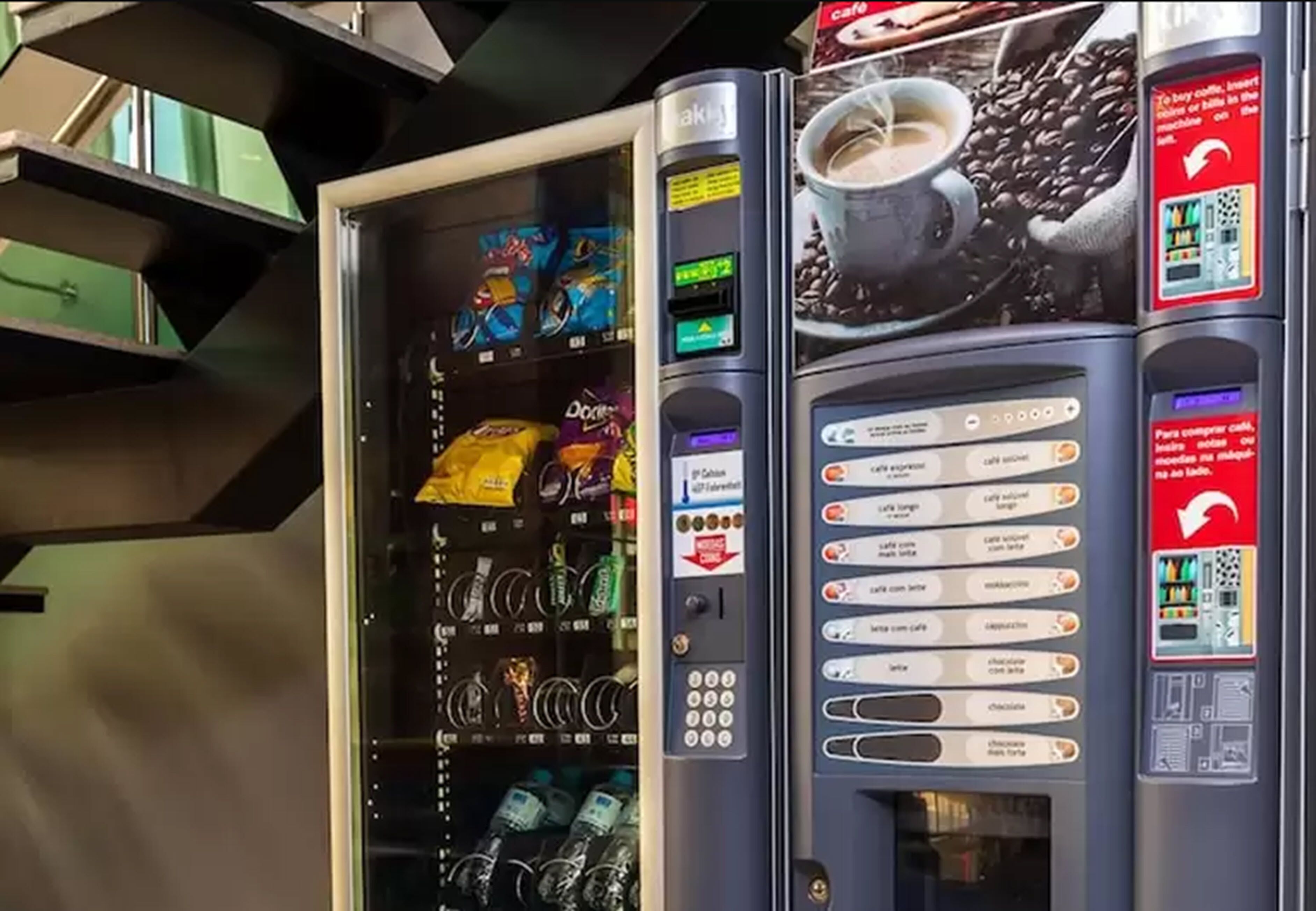 A vending machine with various snacks and beverages, including chips and bottled water.