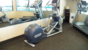 A gym with treadmills, an elliptical, and a stationary bike. - Best Western Plus Cottontree Inn (Idaho Falls)