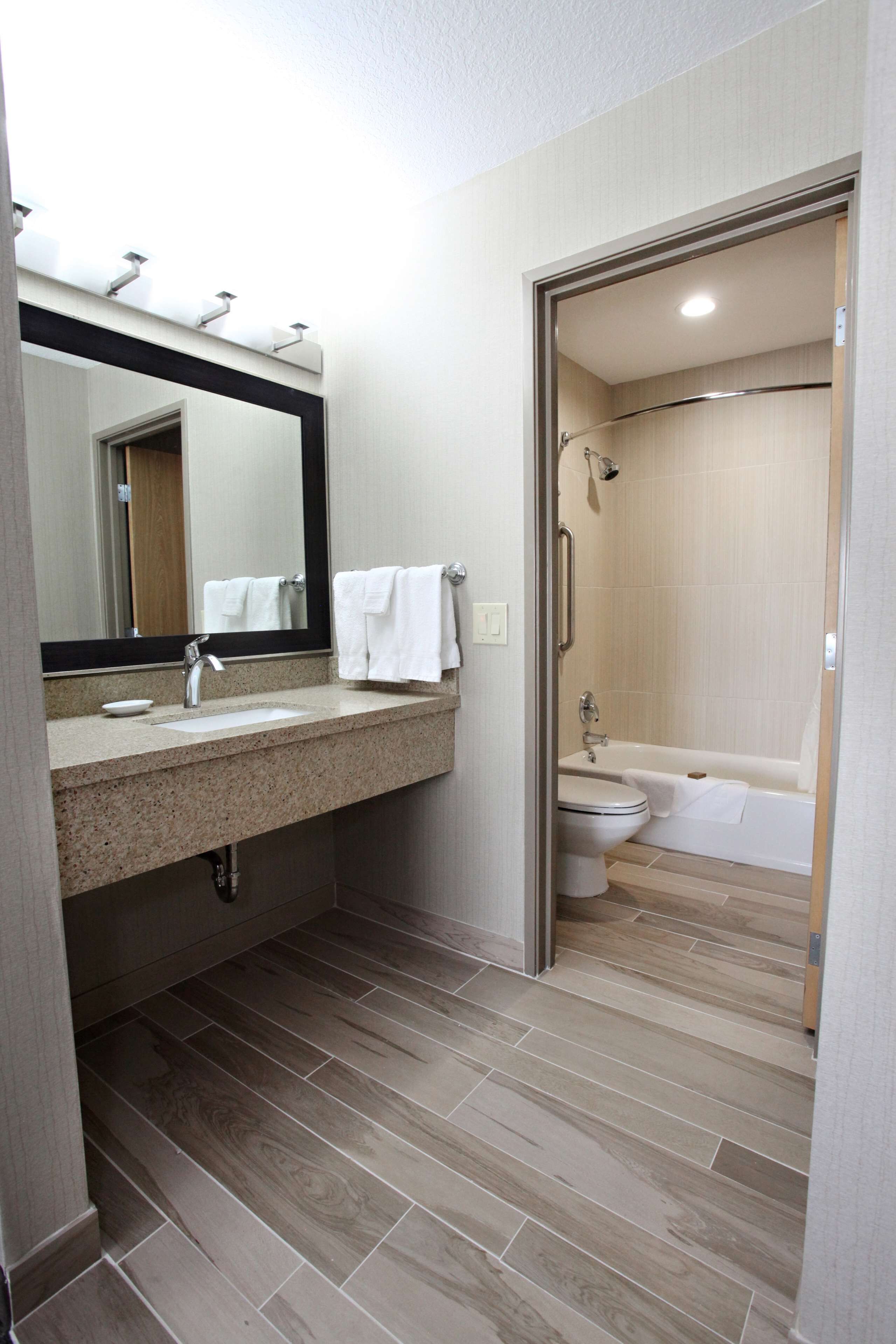 suite, 1 king bed, non smoking, refrigerator | bathroom | combined shower/bathtub, free toiletries, hair dryer, towels