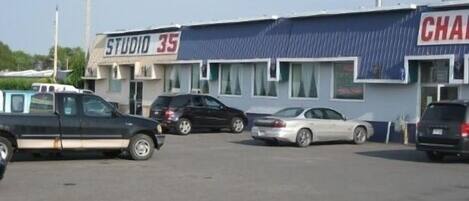A parking lot with a building labeled "STUDIO 35" and another building with "CHAM" partially visible.