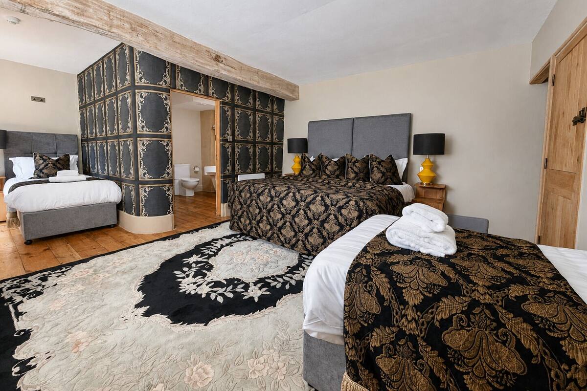 Family Quadruple Room | Iron/ironing board, WiFi (surcharge), bed sheets