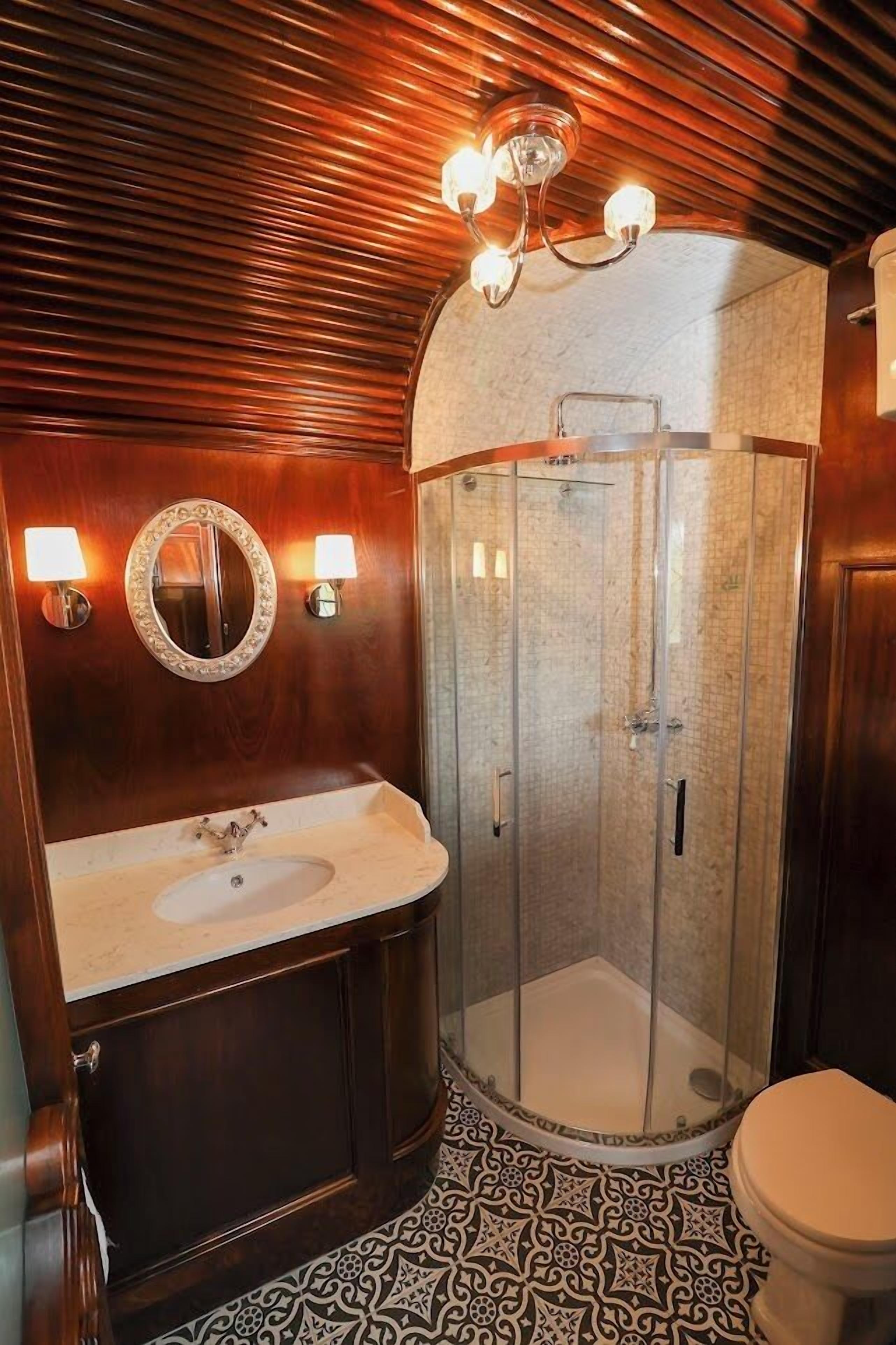 signature suite | bathroom | designer toiletries, hair dryer, towels