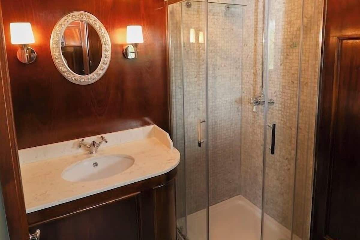 signature suite | bathroom | designer toiletries, hair dryer, towels