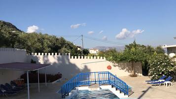 Seasonal outdoor pool, pool umbrellas, sun loungers