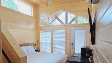 Deluxe Cabin | Living area | 65-inch Smart TV with digital channels