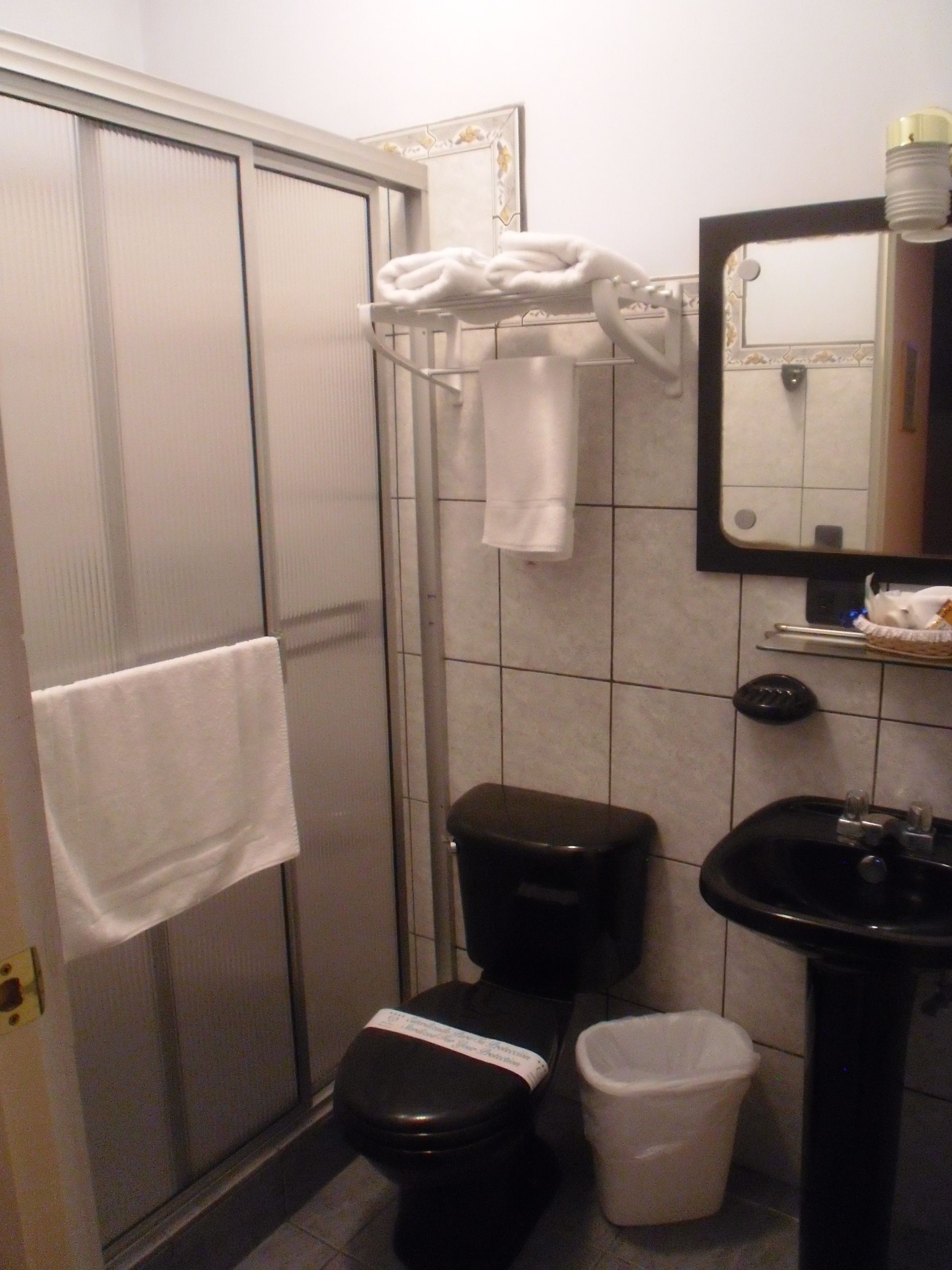 standard double room | bathroom | combined shower/bathtub, rainfall showerhead, hair dryer, towels