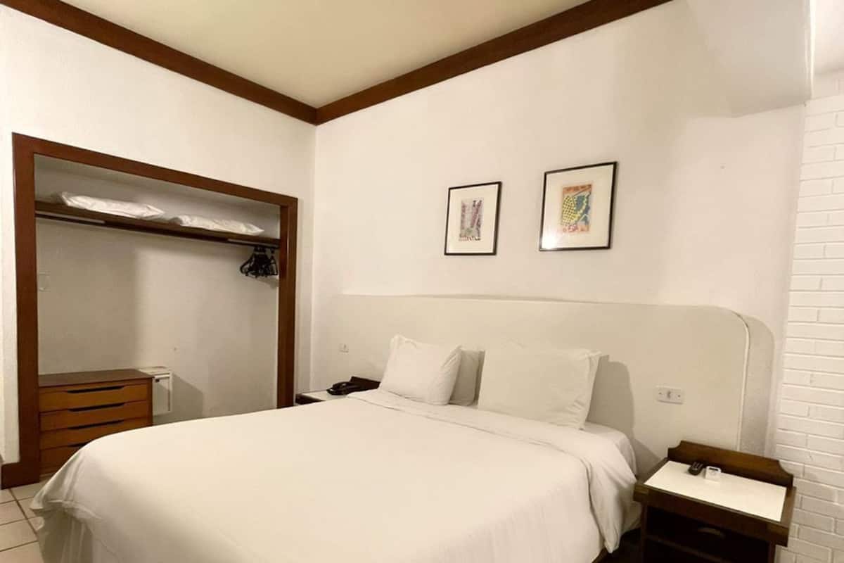 Suíte luxo, no jardim | Frigobar, roupa de cama