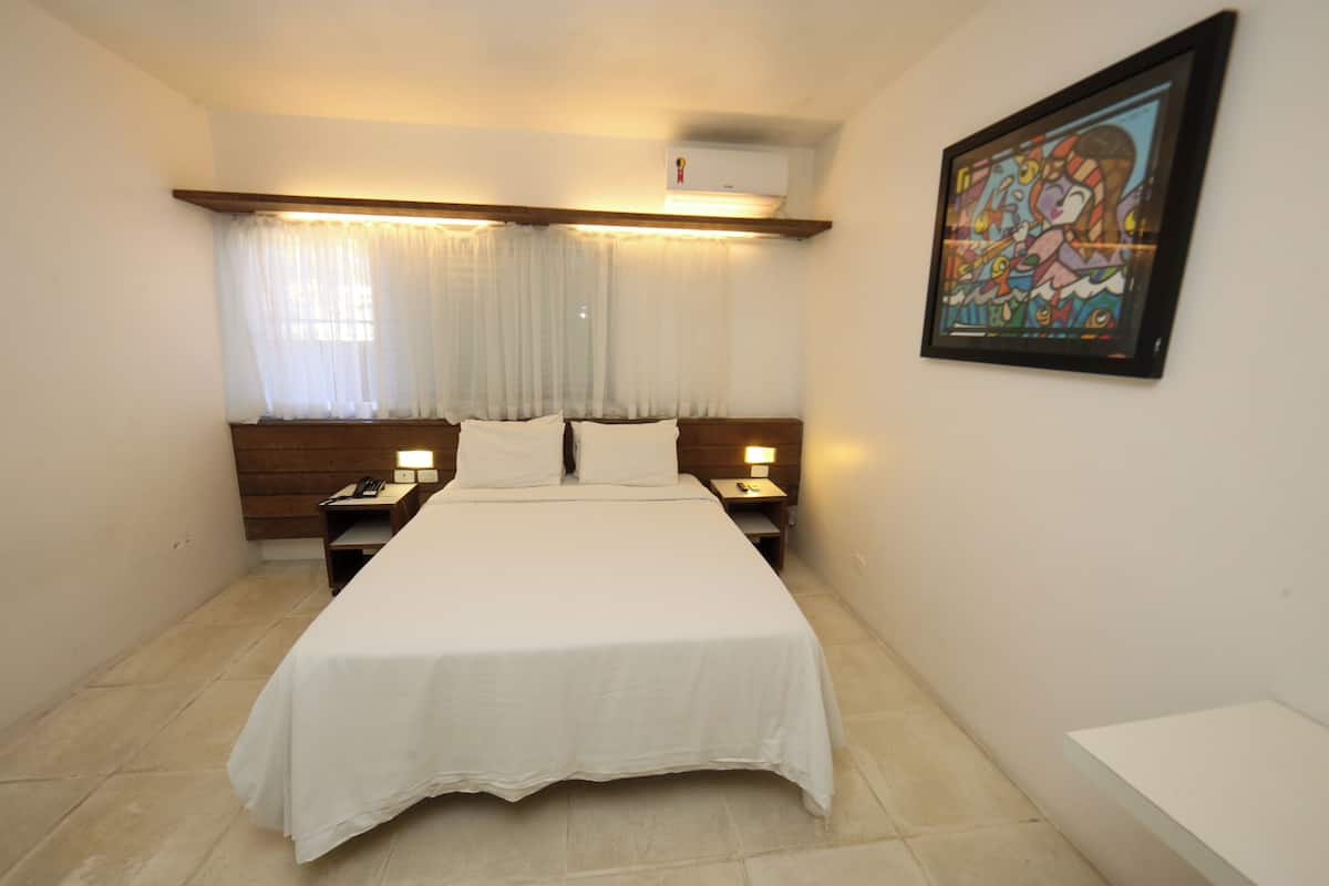 Quarto superior, 1 cama de casal | Frigobar, roupa de cama