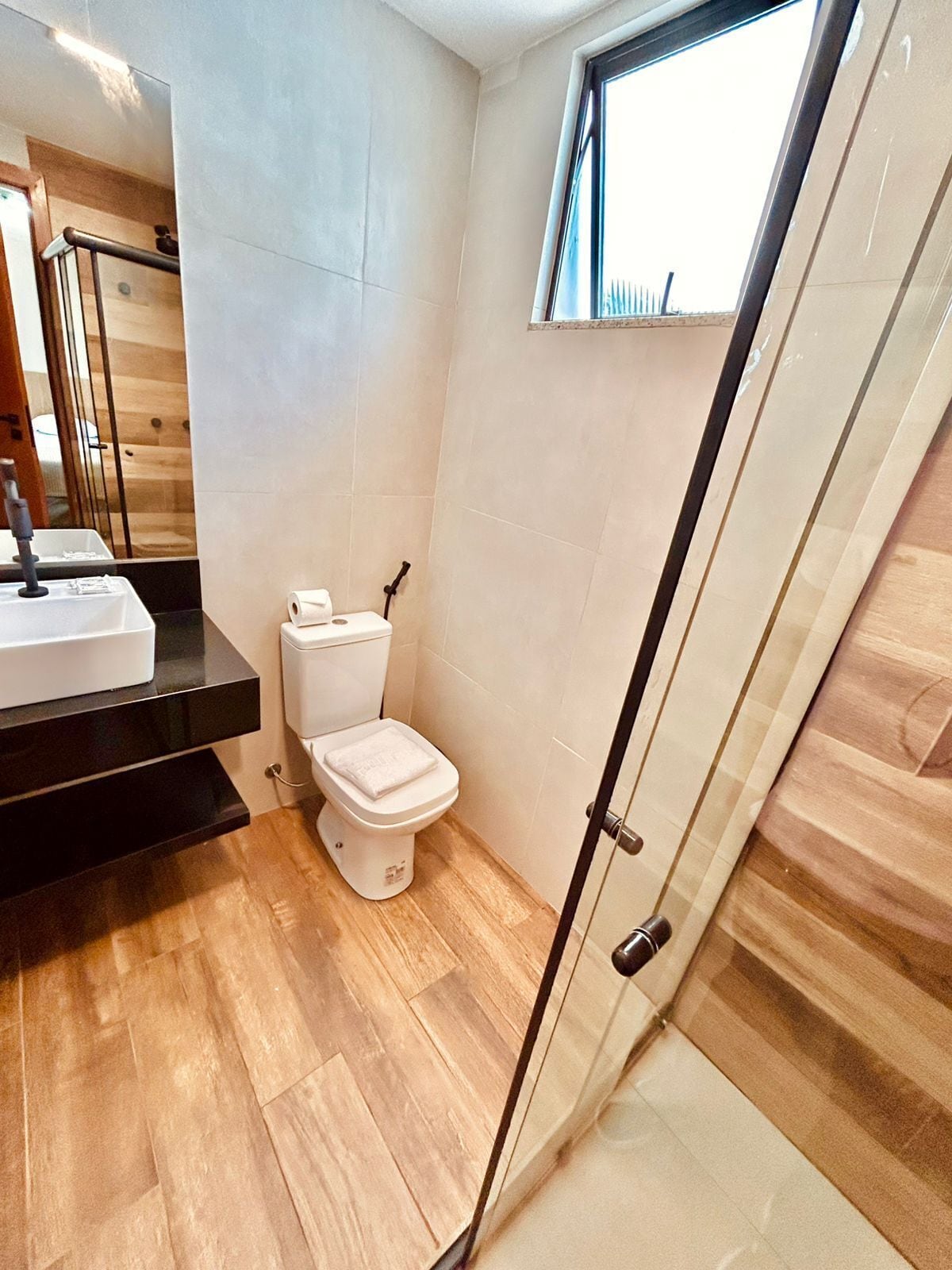 superior single room | bathroom | shower, rainfall showerhead, hair dryer, towels