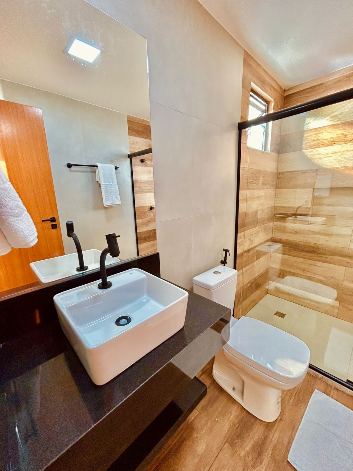 shower, rainfall showerhead, hair dryer, towels