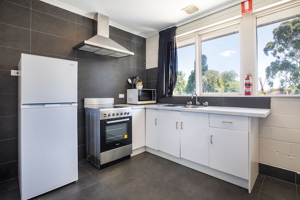 Family Apartment | Private kitchen | Mini-fridge, microwave, coffee/tea maker, electric kettle