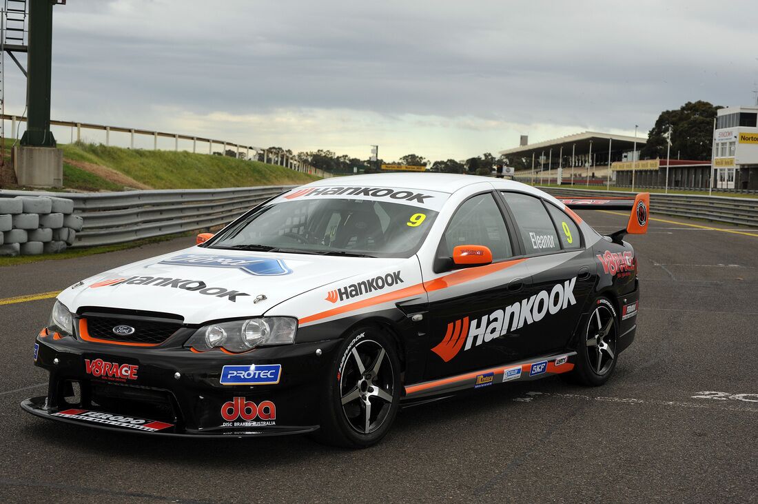 A race car with the number 9 on a track.