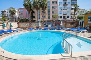 Outdoor pool, pool umbrellas, sun loungers