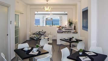 Breakfast, lunch, dinner served; Regional cuisine, beach views