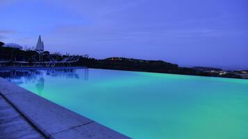 Seasonal outdoor pool, pool umbrellas, sun loungers