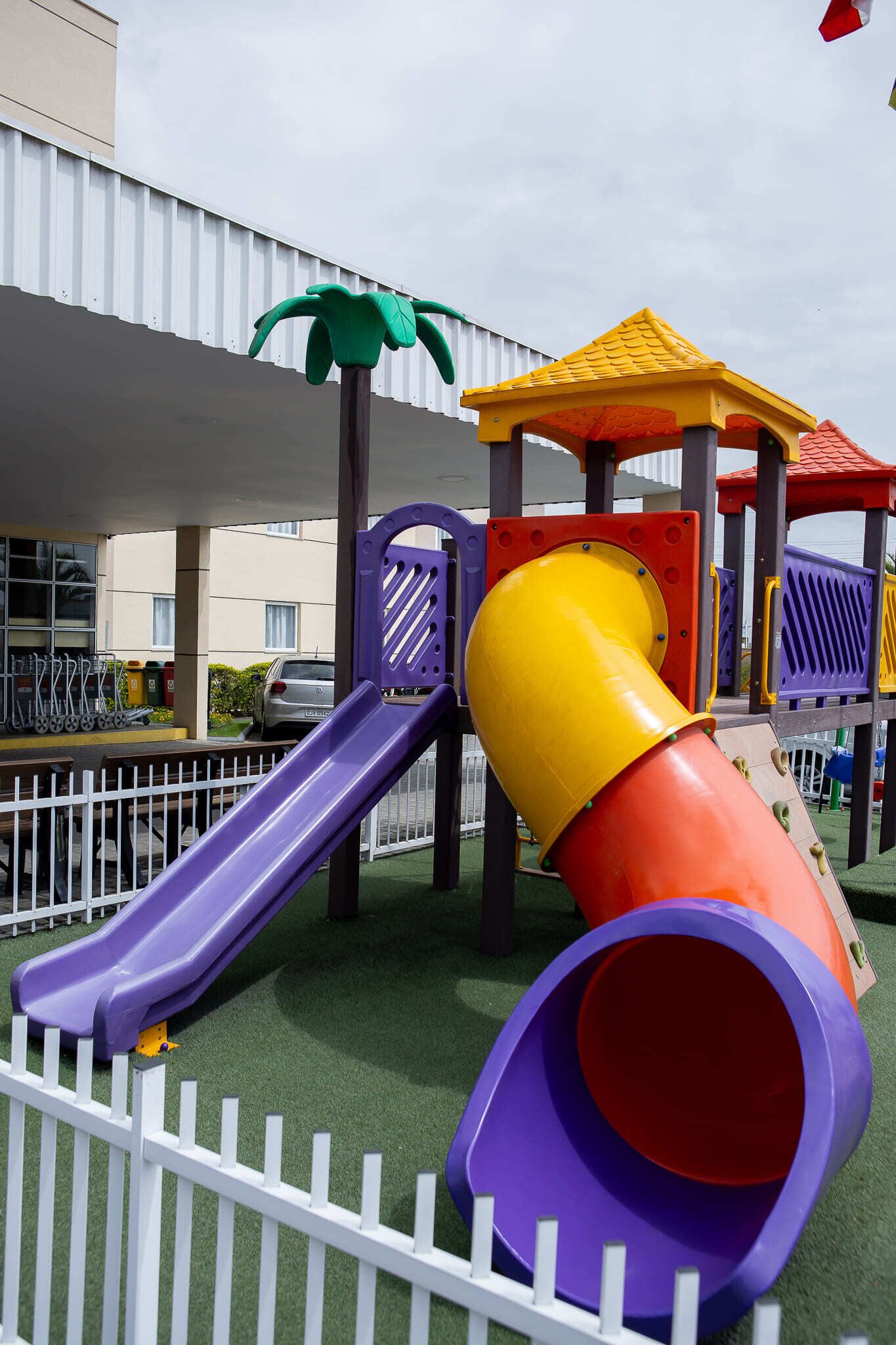 A playground with slides and climbing structures.