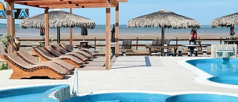 2 outdoor pools, open 10:00 AM to 6:00 PM, pool umbrellas, sun loungers