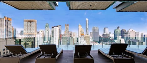 Outdoor pool, open 7:00 AM to 9:00 PM, pool umbrellas, pool loungers