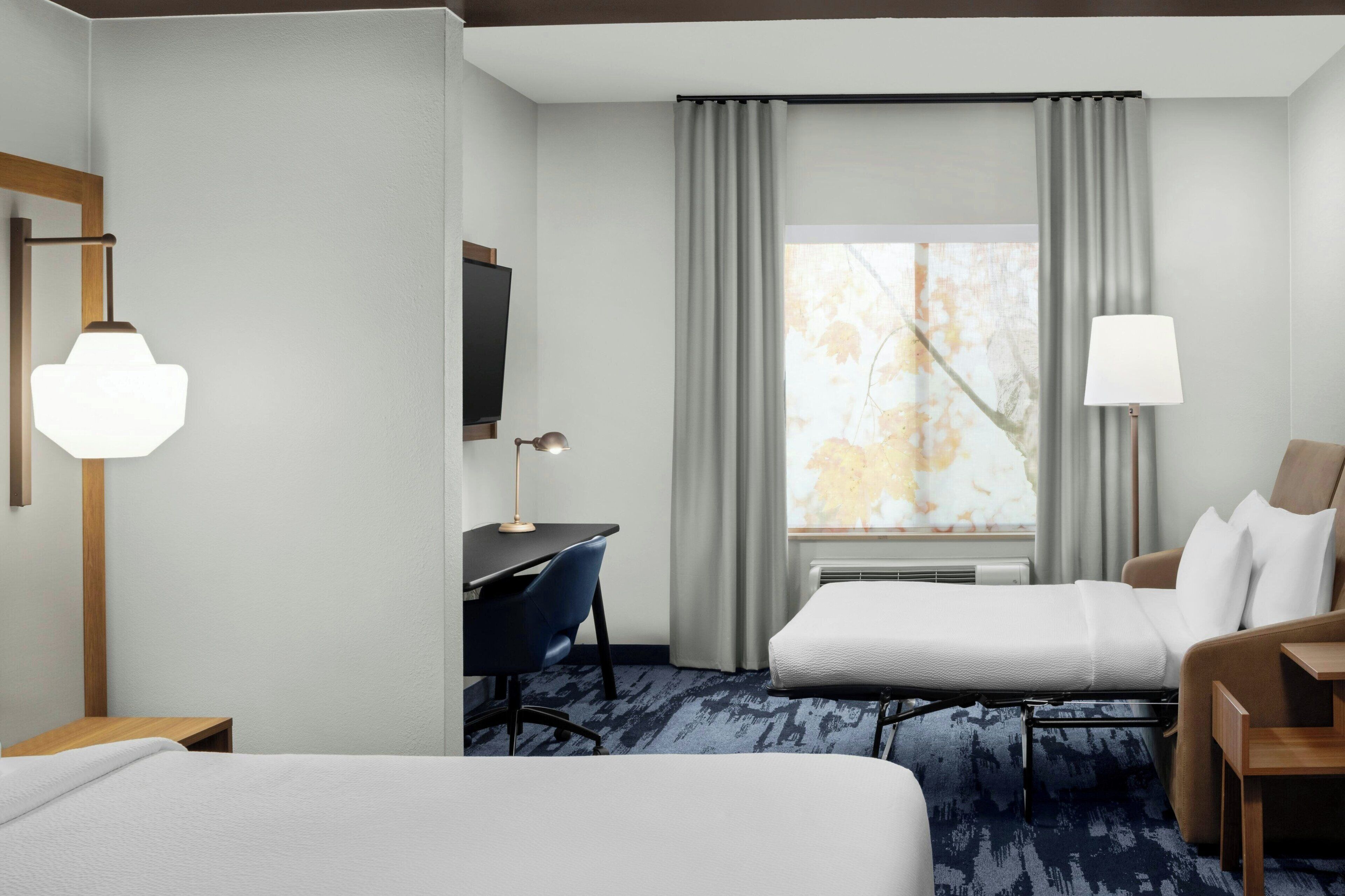 desk, blackout curtains, iron/ironing board, free cots/infant beds