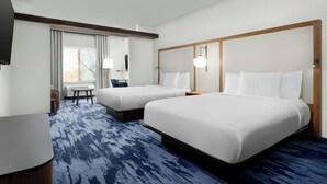 A hotel room with two beds, a desk, a chair, and a large window with curtains. - Fairfield Inn & Suites Riverside Corona/Norco (Norco)