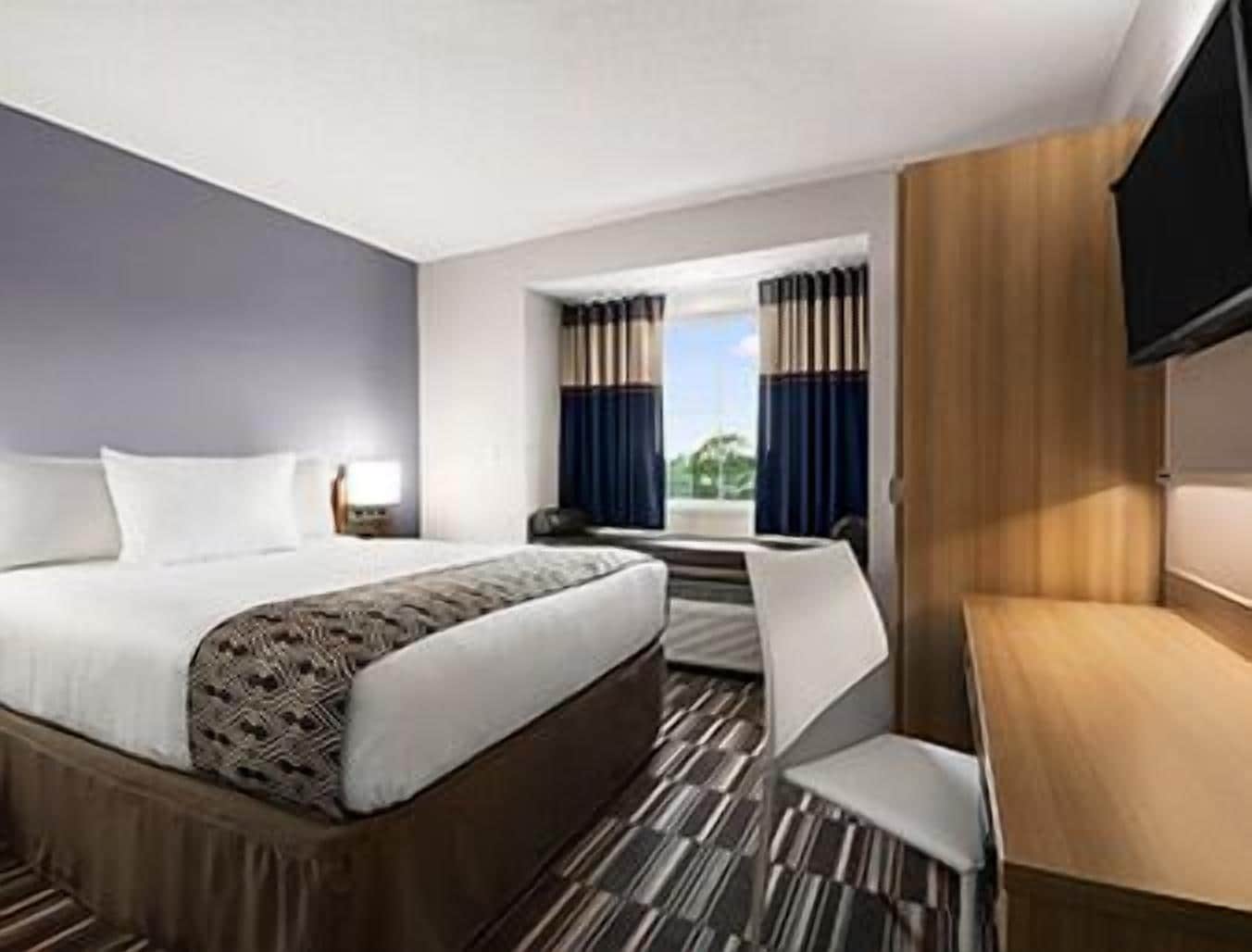 desk, laptop workspace, blackout curtains, iron/ironing board