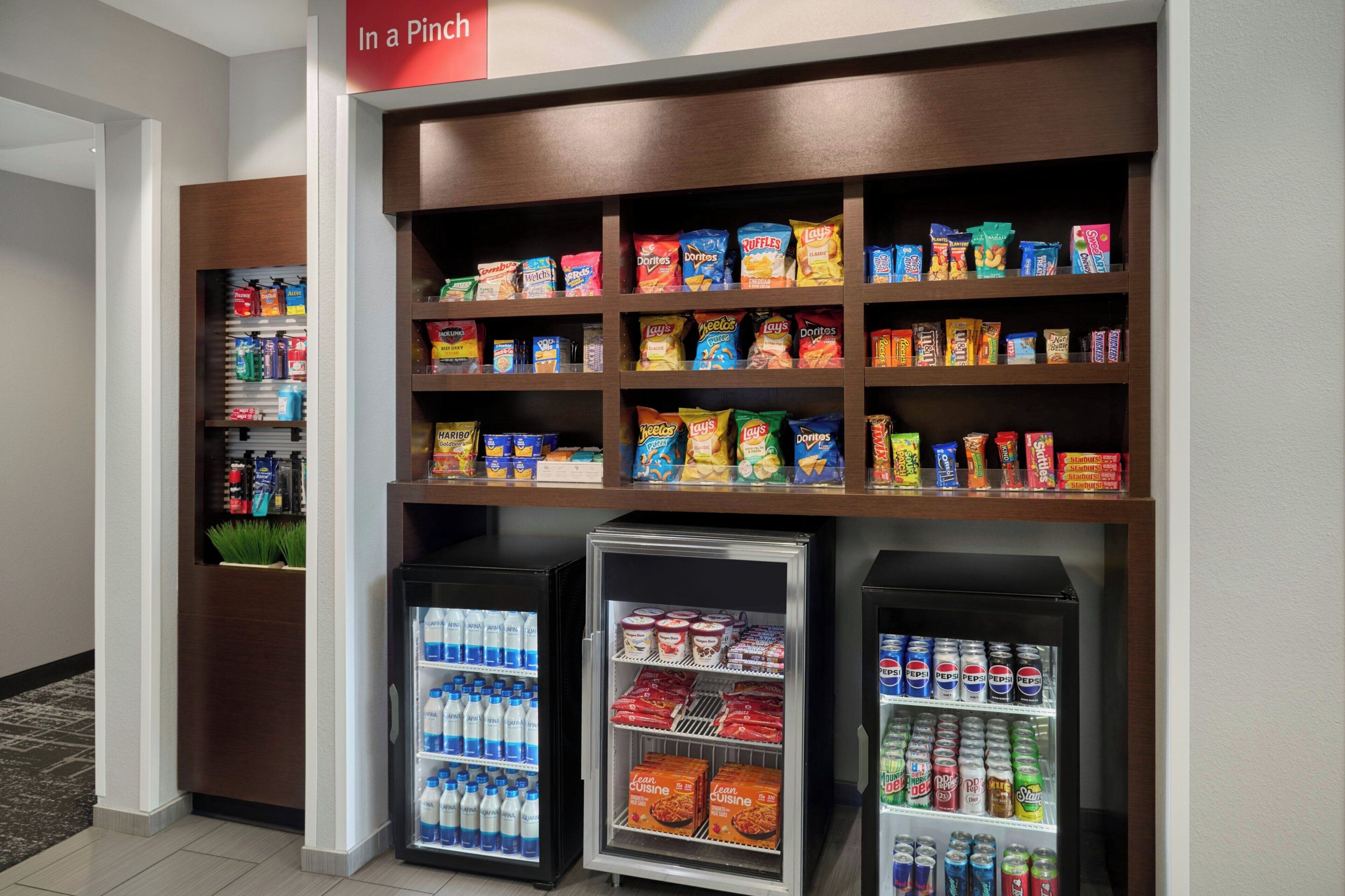 A snack and beverage vending area with various snacks and drinks.