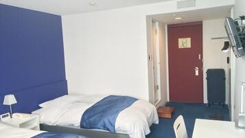 Desk, blackout drapes, iron/ironing board, rollaway beds