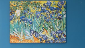A room with a blue wall, a white desk, a white chair, a red kettle, and a small white refrigerator. - La Residenza di Michelangelo (Florence)