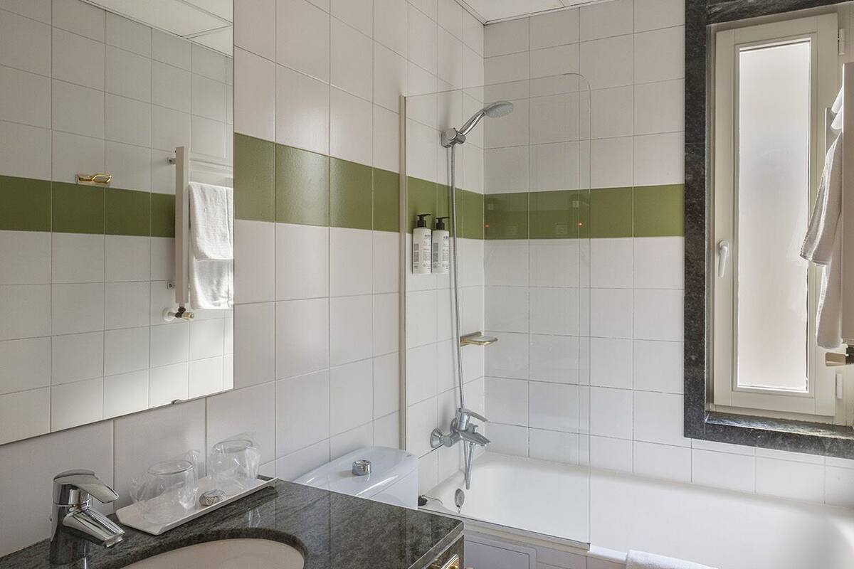 designer toiletries, hair dryer, towels, soap