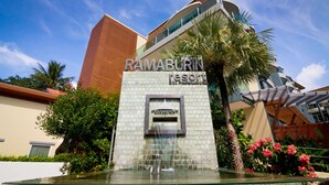 A modern building with a sign reading "RAMABURIN Resort." - Ramaburin Resort (Patong)