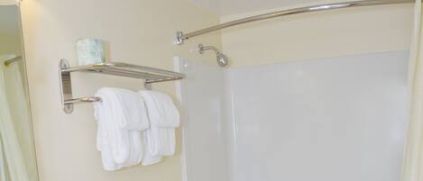 A bathroom with a sink, toilet, and bathtub.