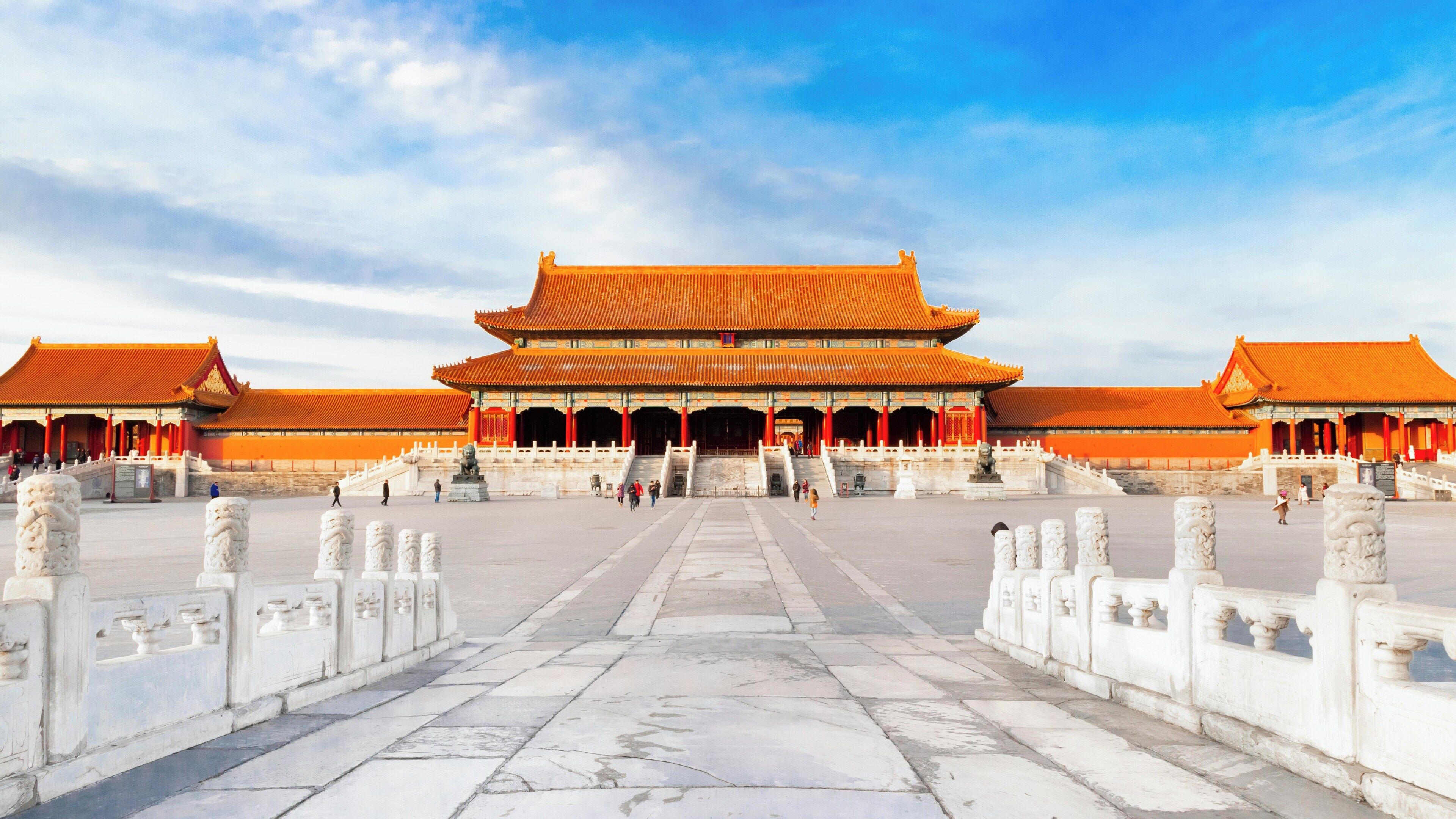A traditional Chinese building with a symmetrical facade, a central entrance, and a wide courtyard.