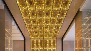 A spacious lobby with a reflective marble floor, a patterned ceiling, and a reception desk with staff. - JW Marriott Hotel Beijing Central (Beijing)